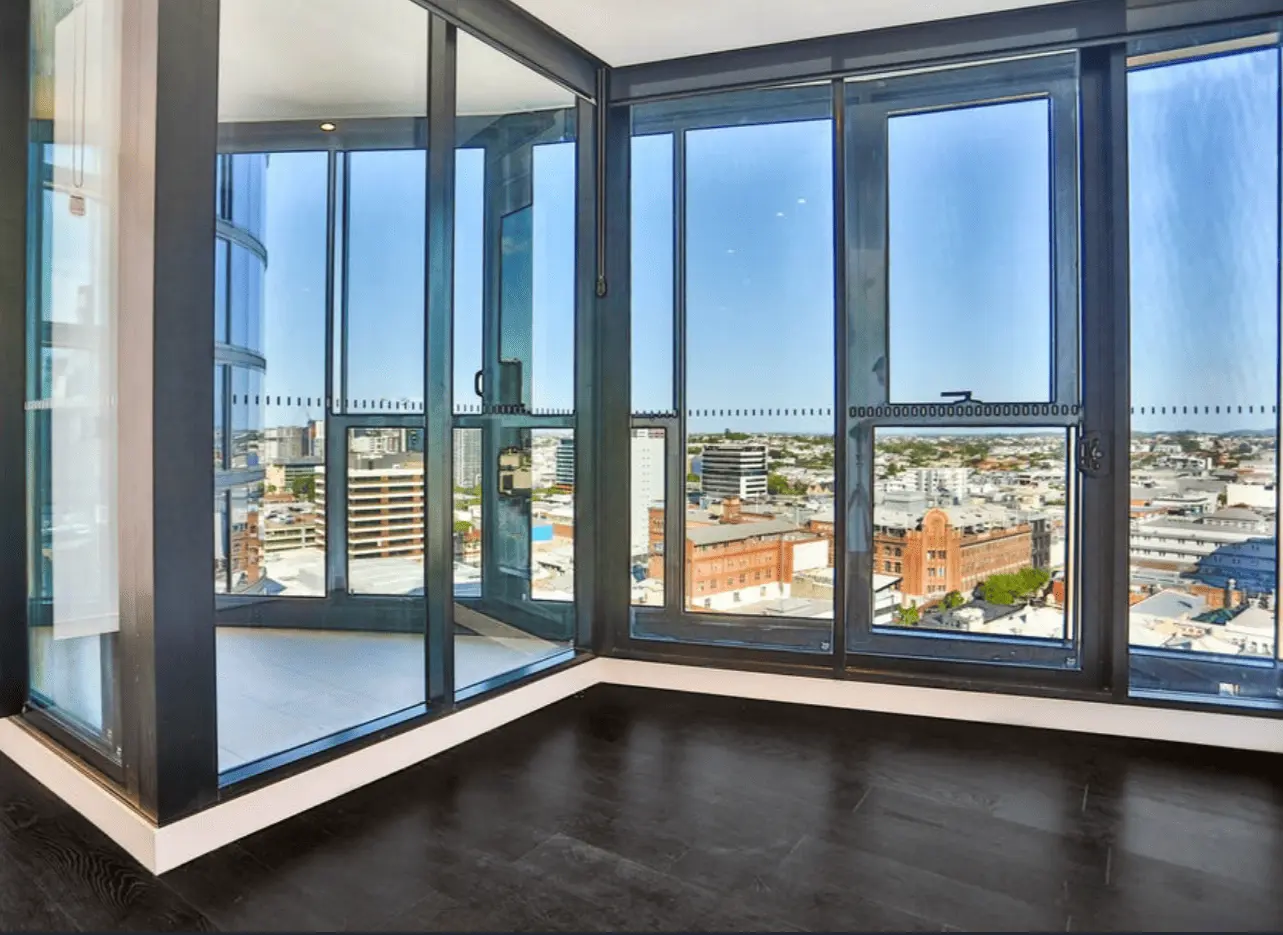 Modern white living room with glass windows with a beautiful view