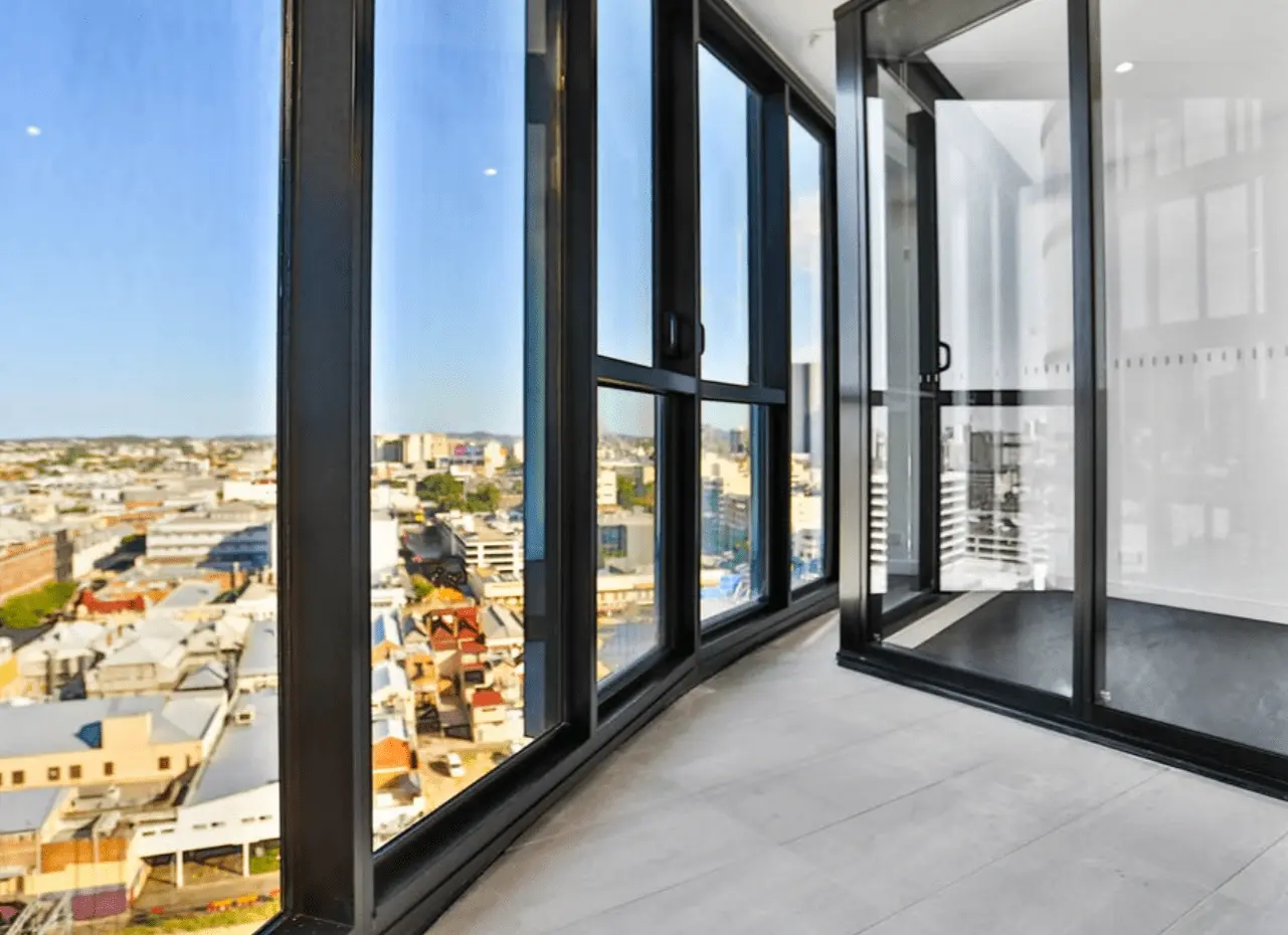 High-rise apartment with panoramic city views through floor-to-ceiling windows