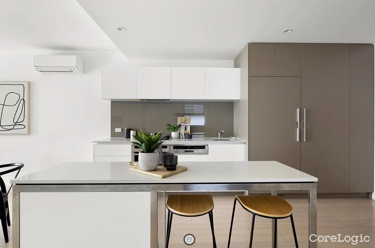 Modern two-tone kitchen with island bench in luxury apartment