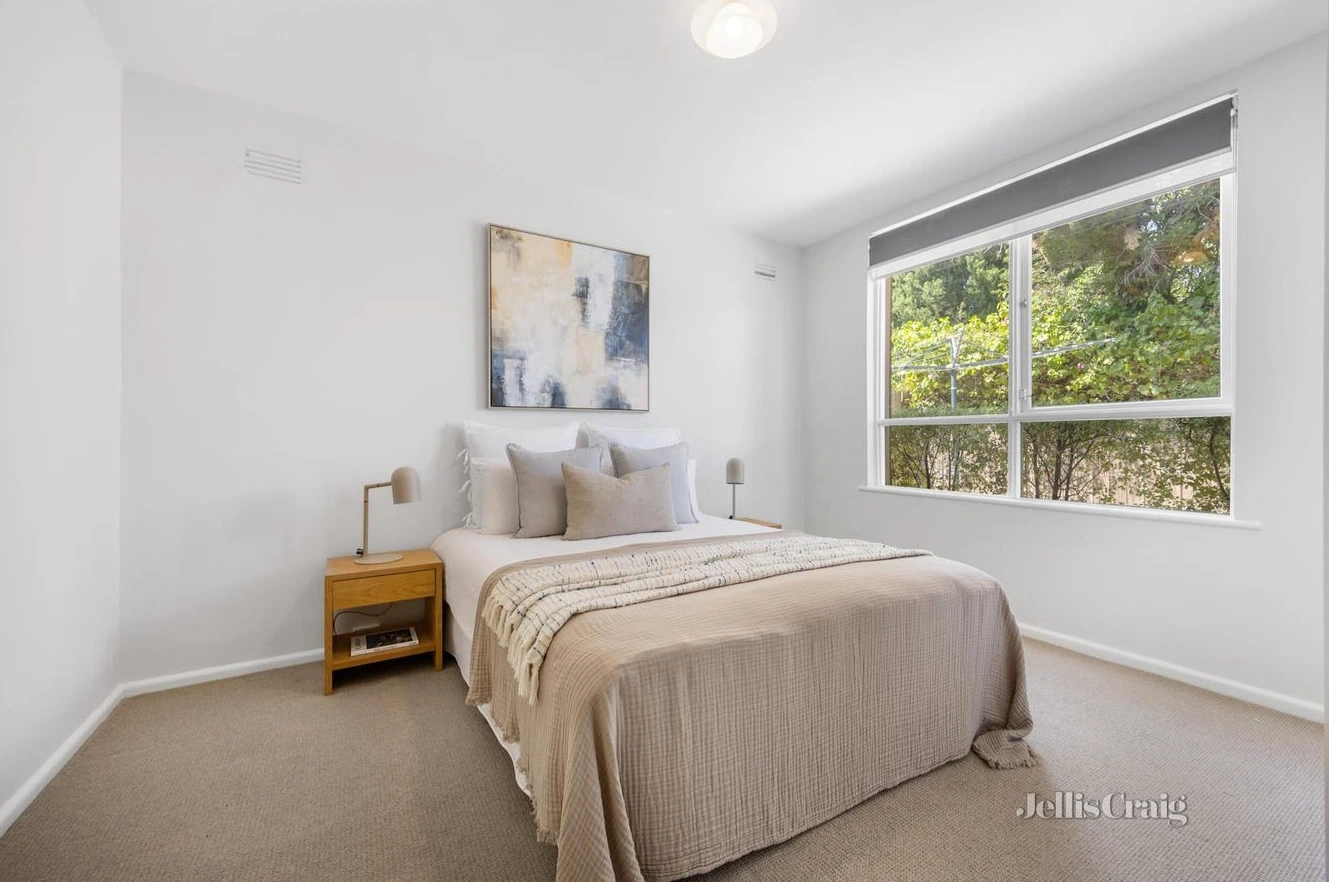Serene bedroom with garden views in Camberwell period home secured by d36 property buyers agent for first-time homebuyer