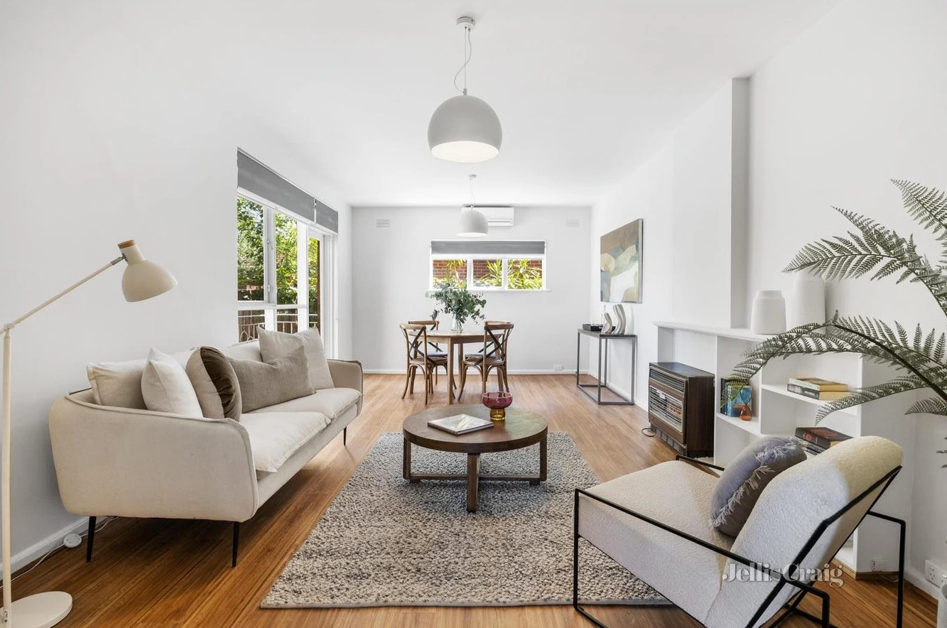 Bright modern lounge room with wooden floors in Camberwell period home secured by d36 property buyers agent