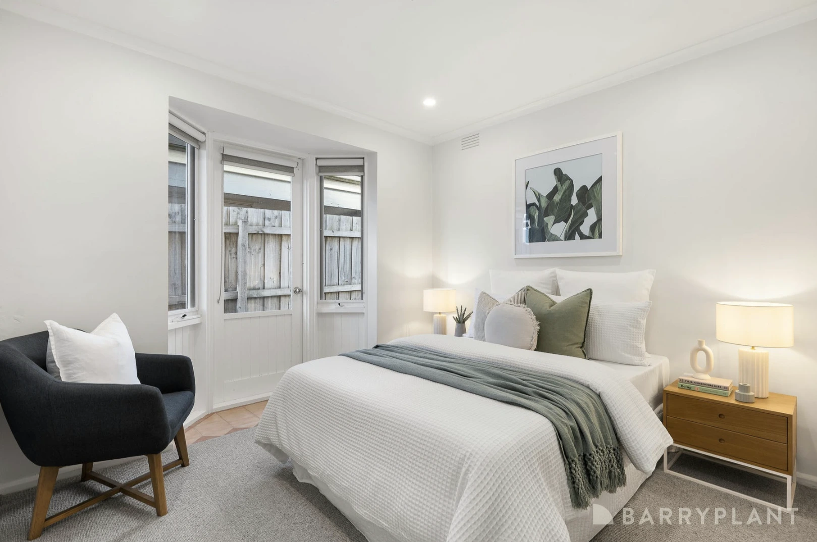A bright and spacious renovated bedroom in a Kilsyth home with fresh paint, new flooring, and a large window.