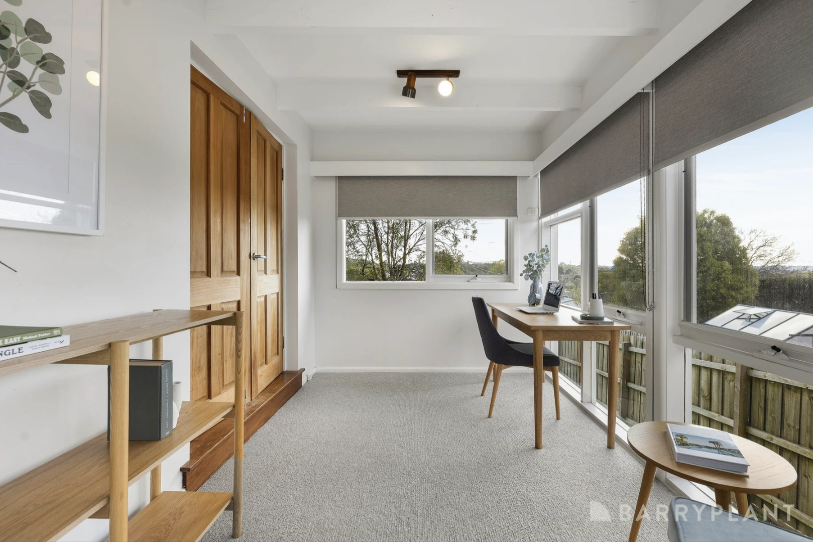 A bright and spacious renovated home office in a Kilsyth house with new flooring and large window providing natural light.