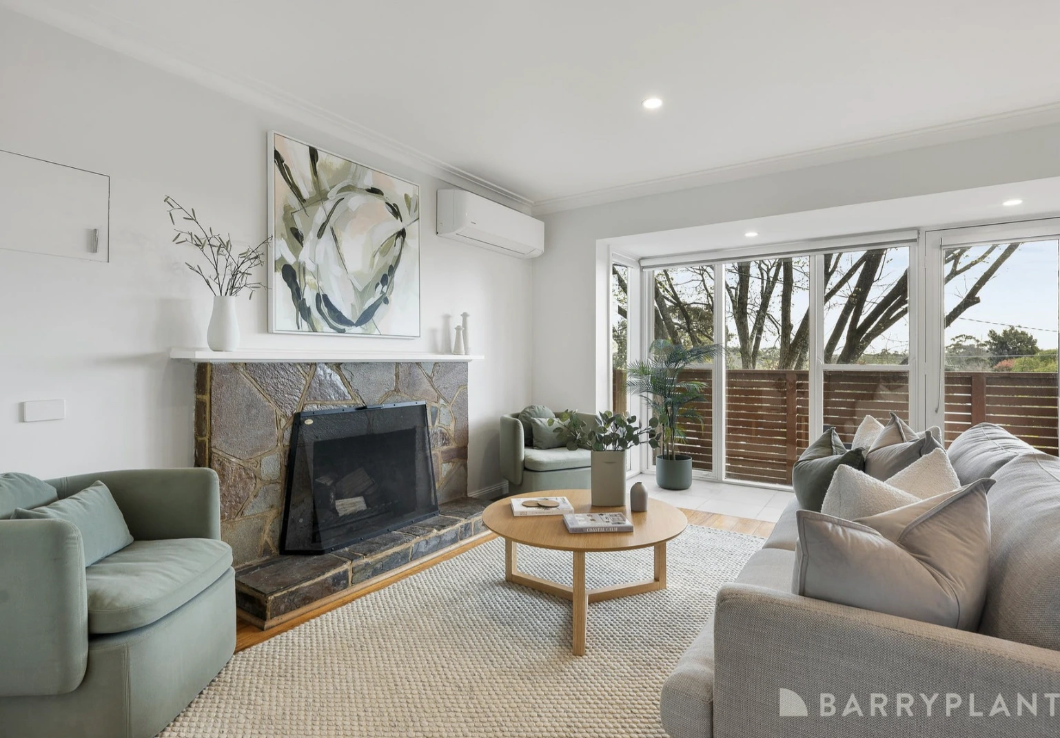 A bright and modern renovated lounge room in a Kilsyth home with new timber flooring and fresh paint.
