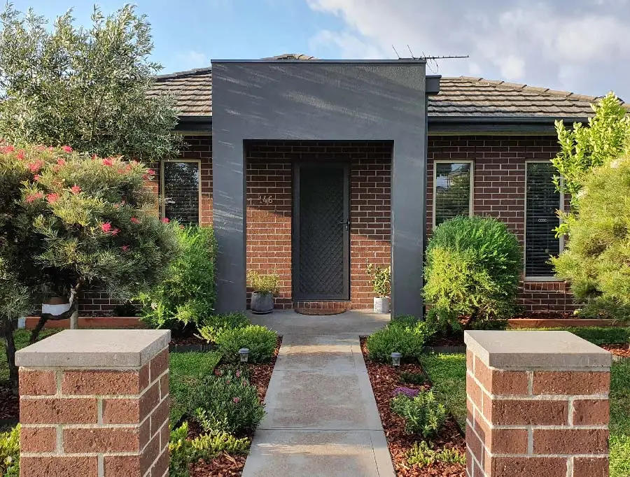 Modern Melbourne brick home renovation with contemporary entrance and landscaping