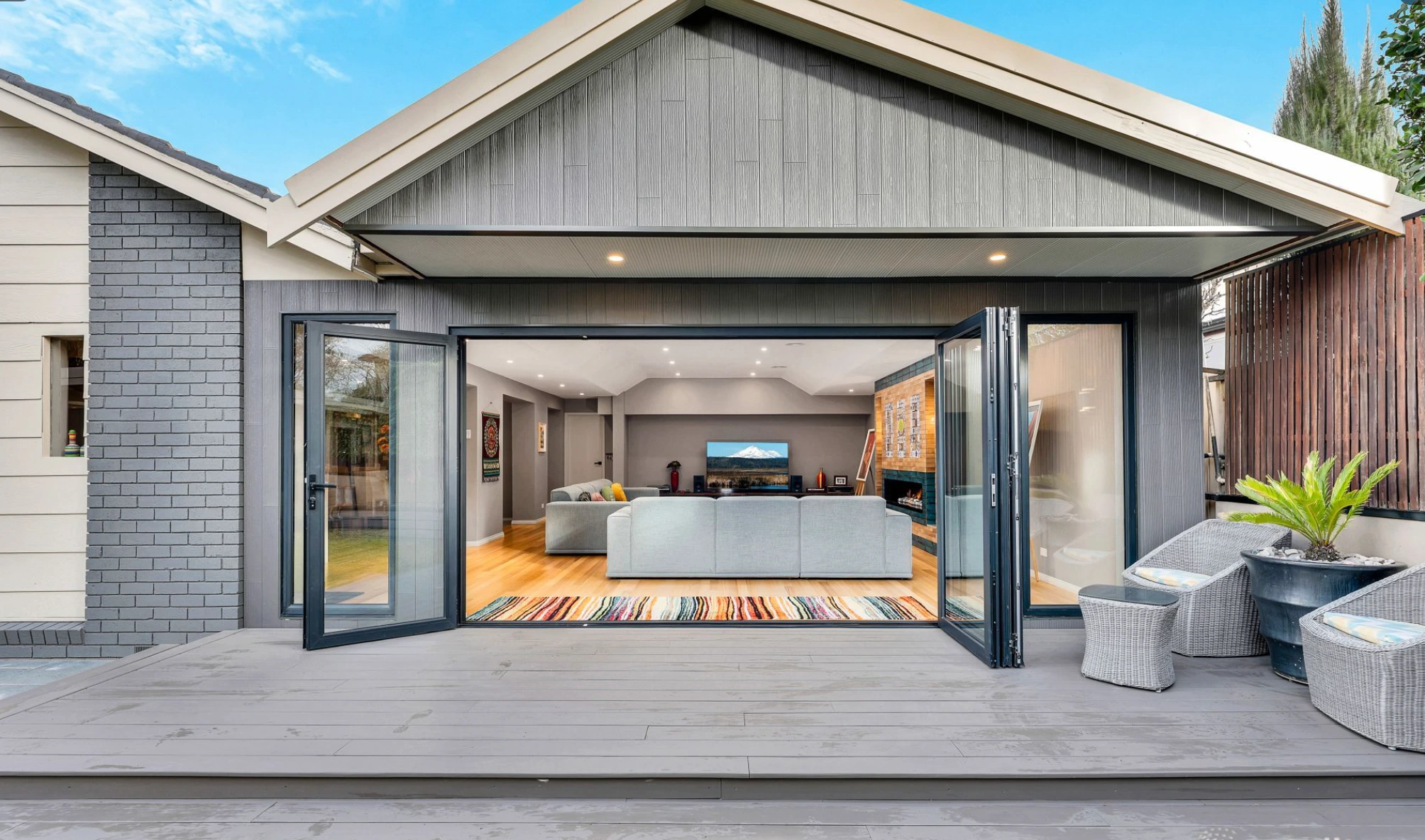 Mill Park home with folding doors opening to deck and outdoor entertaining area