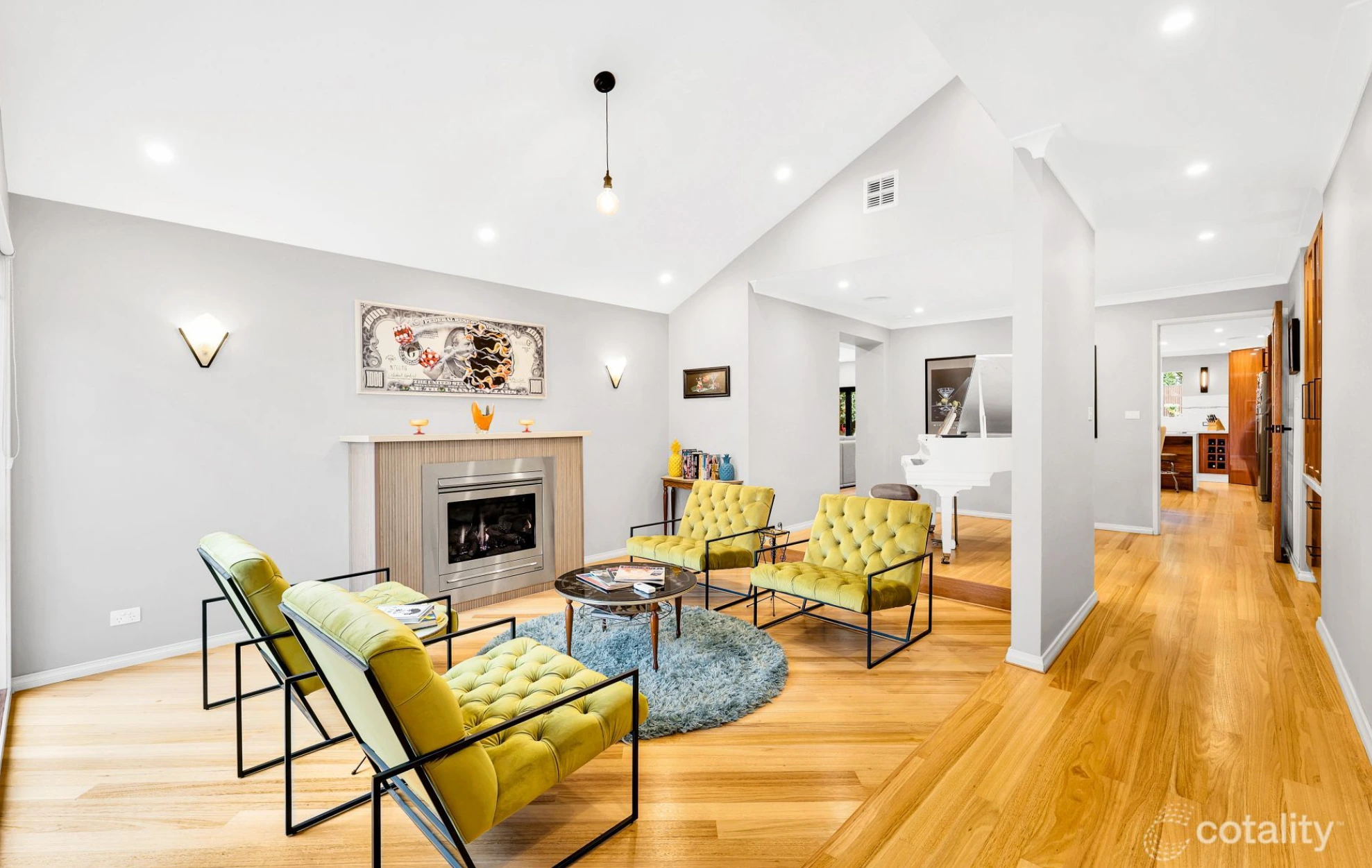 Modern Mill Park living room with large windows, timber flooring, and contemporary furniture