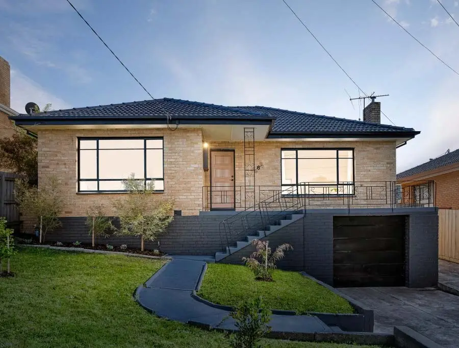 Modernized Reservoir brick home featuring contemporary updates and landscaping