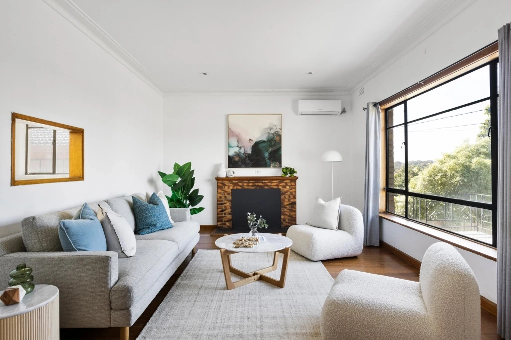 Modern living room with timber fireplace and blue accents