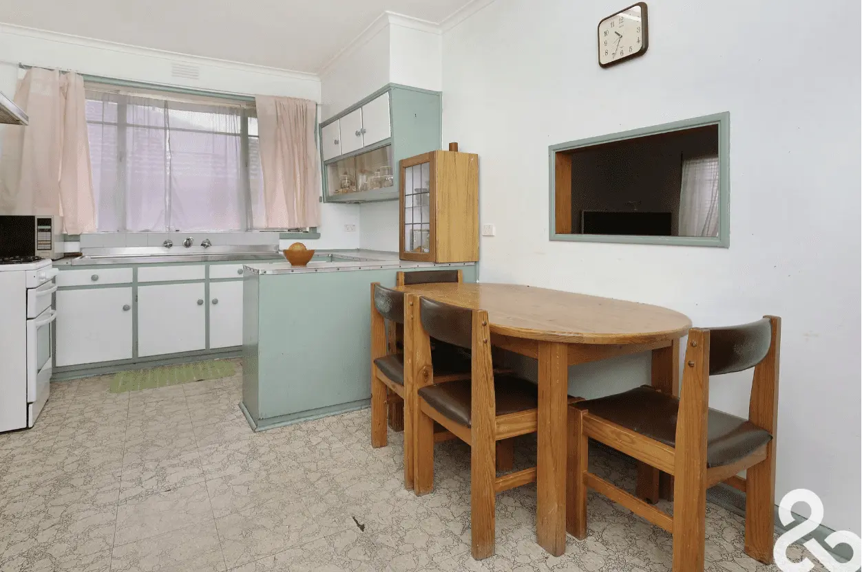 Vintage mint green kitchen with wooden dining set