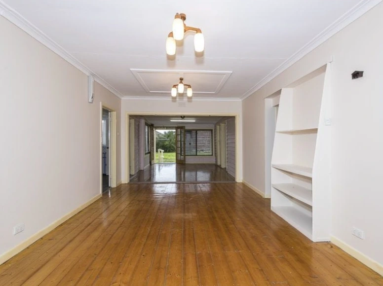 Lounge and living room area of the St Albans property showcasing interior space and renovation potential.