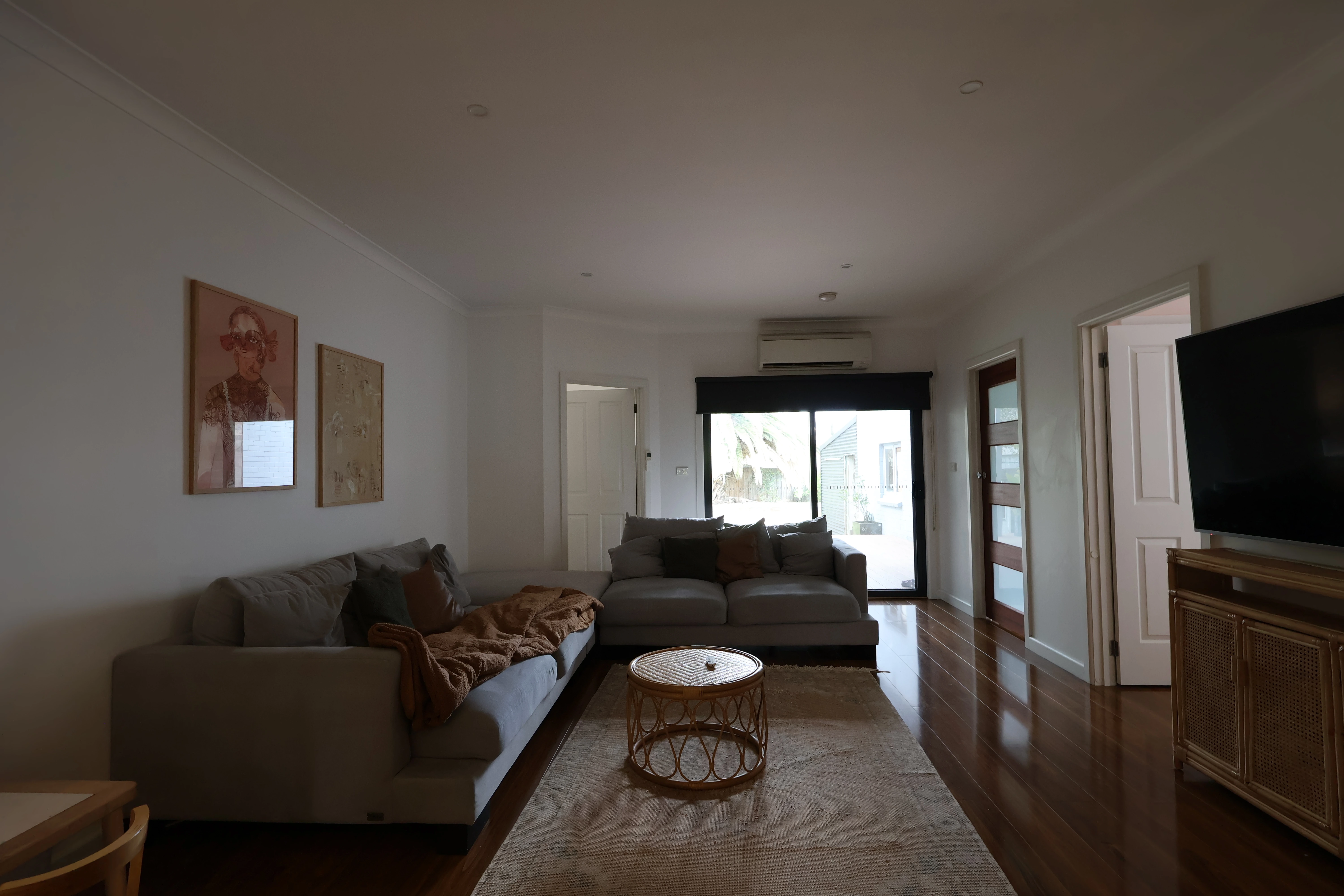 Spacious living room of the Traralgon property showcasing natural light, modern decor, and a welcoming atmosphere.
